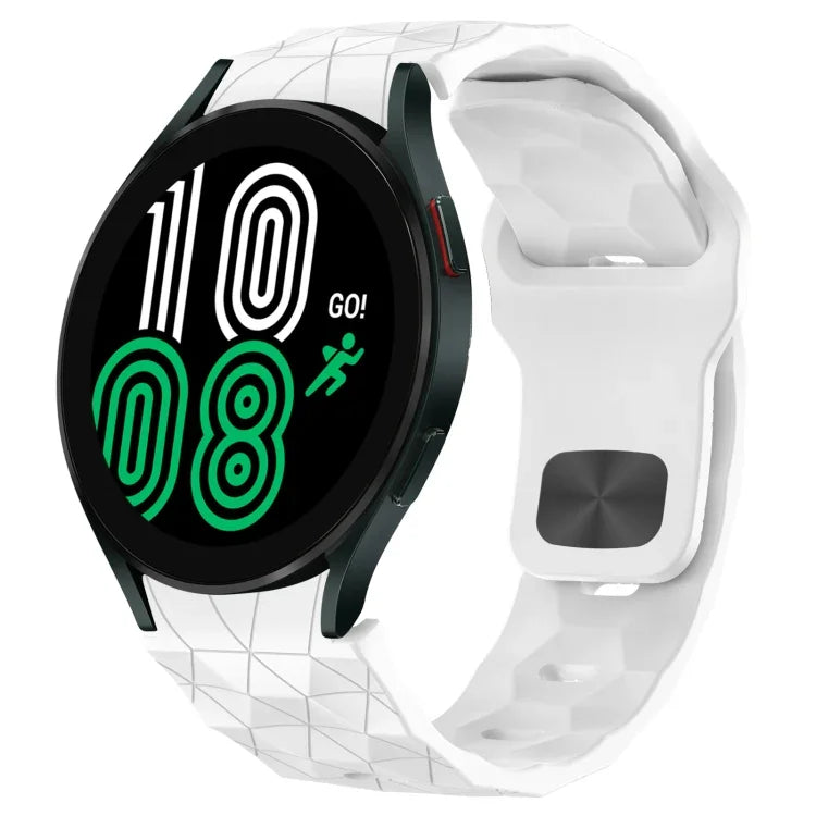 Football texture silicone watch band on Samsung Galaxy Watch 4 showing a digital display in vibrant colors.