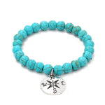 Vòng tay hạt phong cách dân tộc đá Turquoise nữ, S2208-2 Cú, S2208-3 Bướm, S2208-4 Sao biển, S2208-5 Cây sự sống, S2203-12 Thánh giá, S2203-13 Mặt dây chuyền Turquoise, S2212-1 Mắt, S2303-1, S2303-2 Rùa, S2303-3 Thánh giá, S2303-4 La bàn, S2203-11